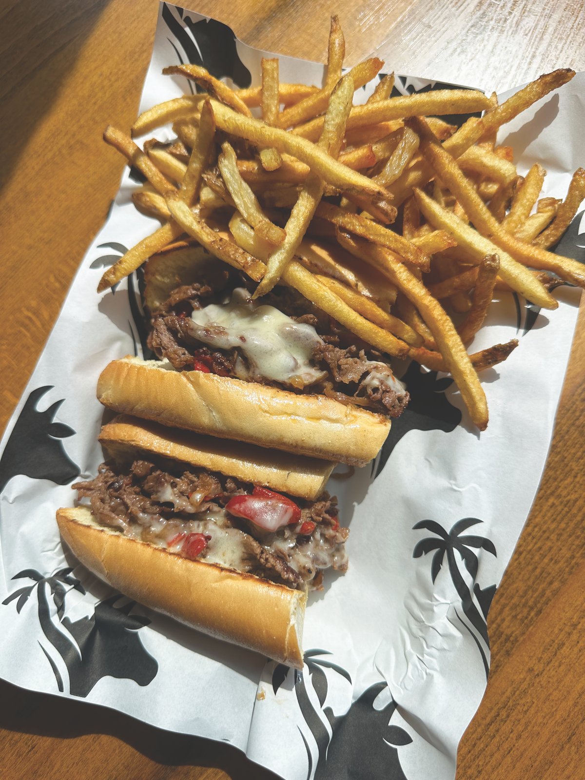 Palm Beach Meats Wagyu Cheesesteak Wagyu cheesesteak with fries at Palm Beach Meats in Orlando’s SODO District