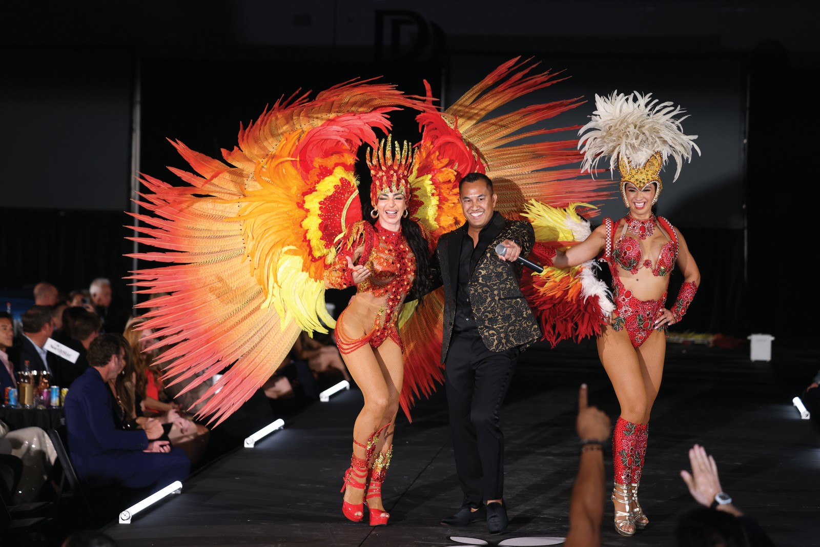 Fashion & Hope 2026 Runway Feathered showgirl costumes on the runway at Fashion & Hope 2026 at Fields Motorcars