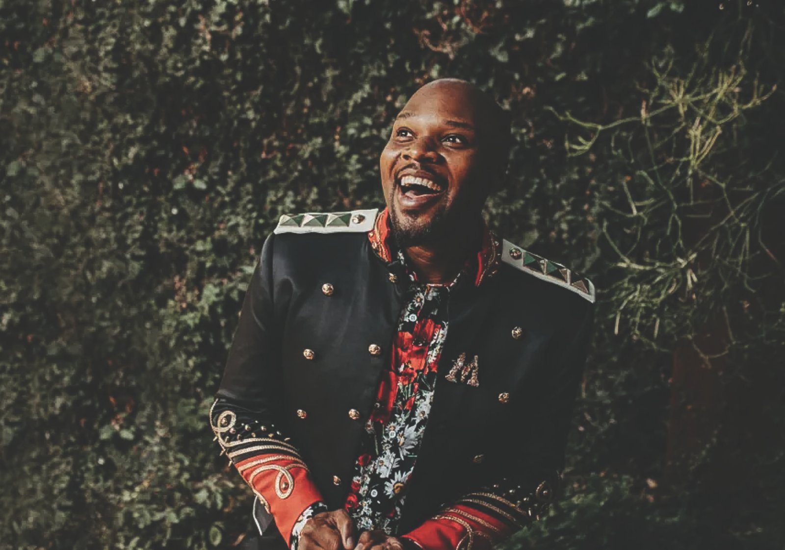 Michael James Scott Broadway performer Michael James Scott smiling in a military-style jacket